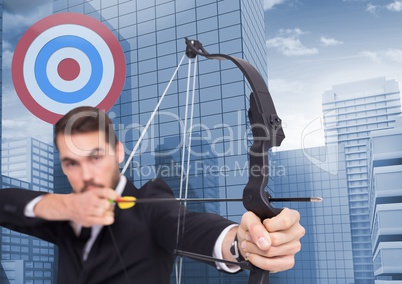 Businessman aiming at target with bow and arrow