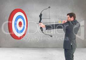 Businessman aiming at target with bow and arrow