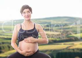 Pregnant woman touching belly
