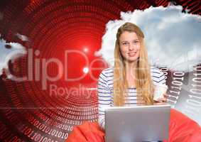 Woman using laptop against binary background