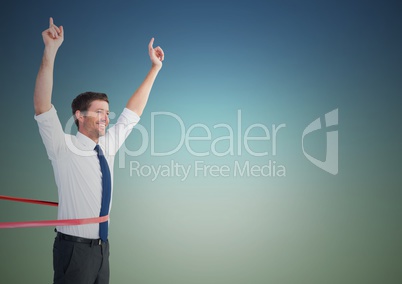 Businessman crossing finish line with arms up