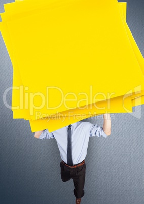 Digital composite image of a businessman carrying a stack sticky notes