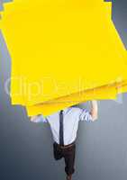 Digital composite image of a businessman carrying a stack sticky notes