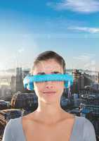 Digital composite image of woman using virtual reality headset