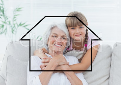 Portrait of grandmother and granddaughter overlaid with house shape in living room