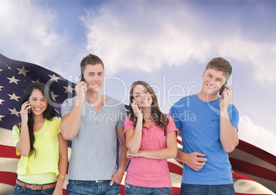 Group of people standing against American flag and talking on mobile phone