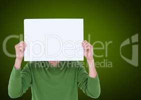 Man holding blank sheet of paper in front of his face