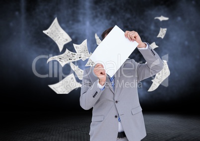 Businessman holding blank placard against data graphics in background