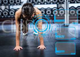 Woman doing push up exercise in gym