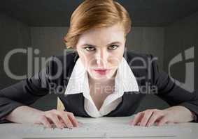 Businesswoman using keyboard on desk