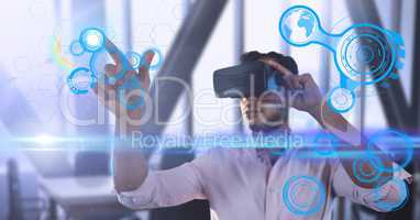 Male executive wearing virtual reality headset with futuristic interface