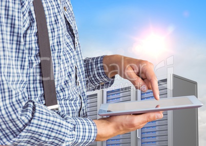 Man using digital tablet against office building in background