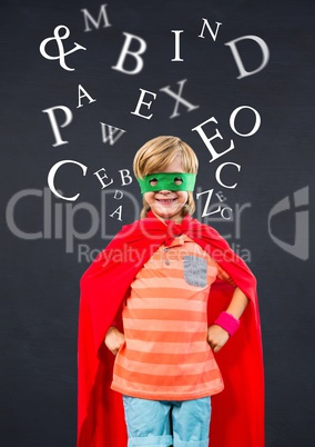 Smiling girl wearing superhero costume standing against digitally generated background