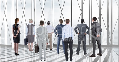 Businesspeople looking out of office window