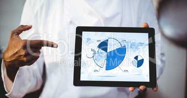 Man showing digital tablet with pie chart on screen