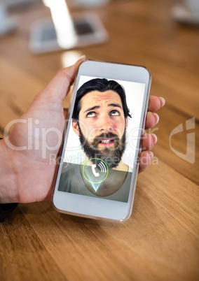 Hand of woman having video calling on mobile phone