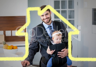 Dad carrying his baby in baby carrier against house outline in background