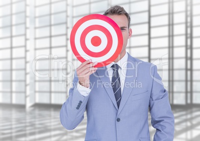 Businessman holding target board