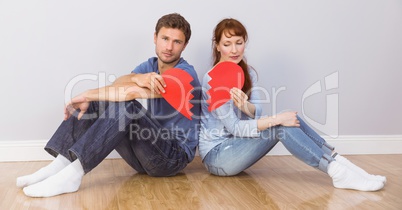 Couple sitting with broken heart