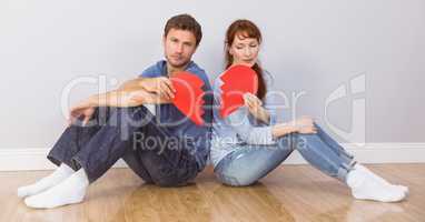 Couple sitting with broken heart