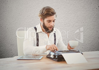 Businessman typing on typewriter at desk