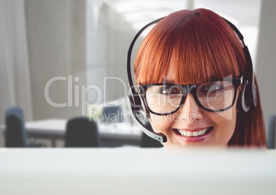 Portrait of a woman talking on headset in customer service office