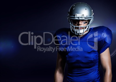 American football player standing against blue background