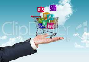 Digital composite image of man hand holding a shopping cart