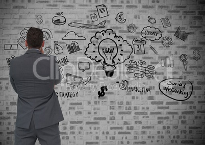 Confused man looking at social networking icons on wall background