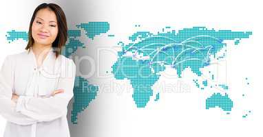 Woman standing with her hands crossed against digitally generated world map background