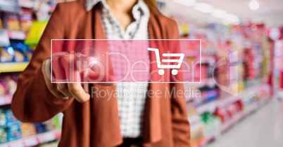 Mid-section of woman touching shopping cart on digital screen
