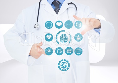 Doctor touching digitally generated medical icons