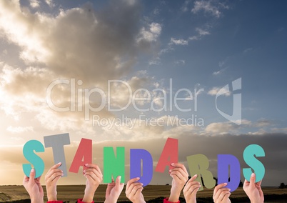 Digital composite image of hands holding standards cutouts