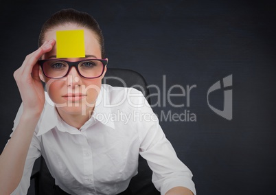 Worried businesswoman with blank sticky note on her forehead