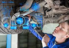 Attentive mechanic repairing hydraulic car
