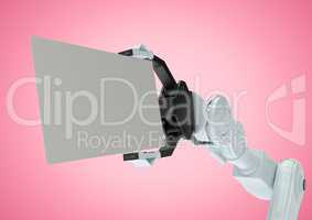 Robot holding blank placard against pink background