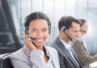 Portrait of smiling customer service woman talking on headset