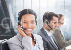 Portrait of smiling customer service woman talking on headset