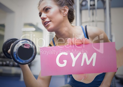 Woman exercising and hand holding paper with text gym