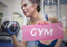 Woman exercising and hand holding paper with text gym