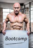 Portrait of bodybuilder holding placard with text bootcamp