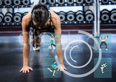 Fit woman performing push up exercise at gym against fitness interfare in background