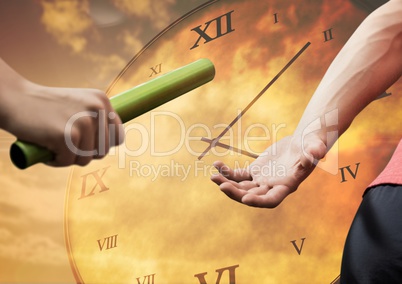 Athlete passing the baton to teammate against clock background