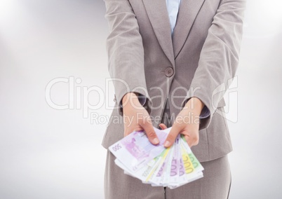 Businesswoman holding euro banknotes