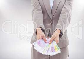Businesswoman holding euro banknotes