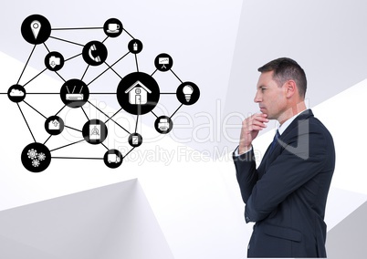 Thoughtful businessman looking at application icons