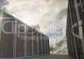 Server room arranged in rows against dusky clouds