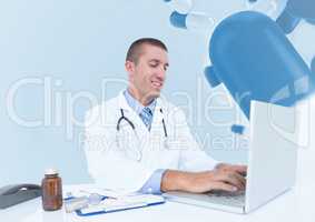 Doctor using laptop against medical background