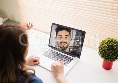 Woman having a video call with her colleague on laptop