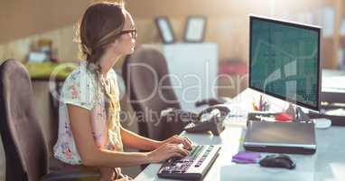 Female graphics designer using computer